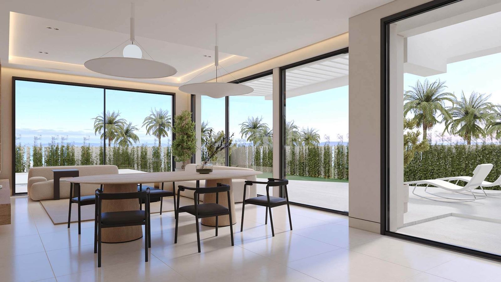 Salle à manger de villa moderne avec vue sur jardin et palmiers.